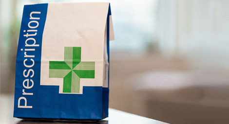 a paper bag that says prescription